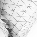 Monochrome abstract architectural structure with triangular geometric patterns.